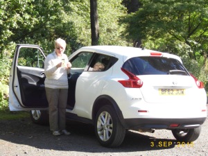 Good lady beside our Quite-Quirky Juke.....